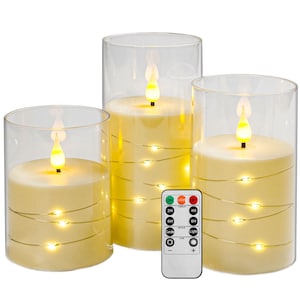 May include: Three cylindrical LED candles in clear glass sleeves, each featuring a cream-colored wax body wrapped in thin copper wire with small warm white fairy lights and a flickering flame-shaped top, accompanied by a white remote control.