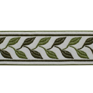 May include: A decorative trim featuring a repeating pattern of green leaves on a white background. The leaves are in varying shades of green, with a darker green border. The trim is suitable for various craft and sewing projects.