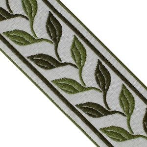 May include: Decorative ribbon featuring embroidered green leaves on a light gray background. The leaves are detailed with varying shades of green, and the ribbon is bordered by dark green stripes. This trim is suitable for various craft and sewing projects.