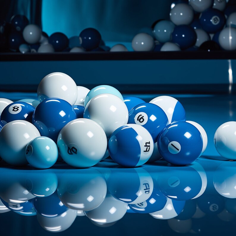 May include: A group of blue and white billiard balls, some with numbers, are arranged on a blue felt surface.