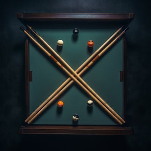 May include: A green felt pool table with two wooden cues crossed in the center. There are six billiard balls on the table, including a white ball, a black ball, and four orange balls.