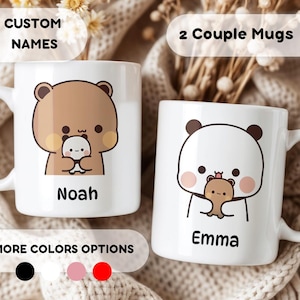 May include: Two white ceramic mugs with custom names, Noah and Emma. Each mug features a cartoon animal holding a smaller cartoon animal. The mug with Noah has a brown bear holding a white panda. The mug with Emma has a white panda holding a brown bear. The mugs are on a white and brown surface.  The text "CUSTOM NAMES" and "2 Couple Mugs" is visible at the top of the image.  The text "MORE COLORS OPTIONS" is visible at the bottom of the image with three color swatches: black, pink, and red.