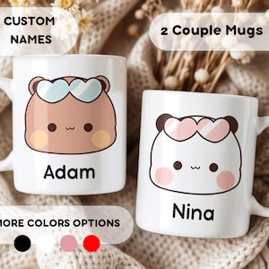 May include: Two white ceramic mugs with cartoon bear designs. One mug has a brown bear with blue sunglasses and the name "Adam". The other mug has a pink bear with pink sunglasses and the name "Nina". Text reads "CUSTOM NAMES" and "2 Couple Mugs".