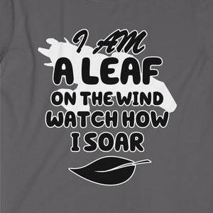 May include: A dark gray t-shirt with a white leaf design and the text "I am a leaf on the wind watch how I soar".