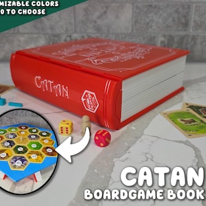 May include: A red Catan board game book with the word "CATAN" on the cover. The image includes game pieces, dice, and cards. The text "CUSTOMIZABLE COLORS OVER 40 TO CHOOSE FROM" is also visible.