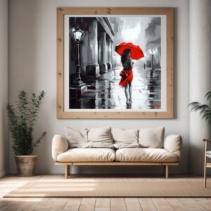 Puede incluir: Una pintura de una mujer caminando bajo la lluvia con una sombrilla roja. La mujer lleva un vestido rojo y se aleja del espectador. La pintura está en estilo blanco y negro, con la excepción de la sombrilla y el vestido rojos.