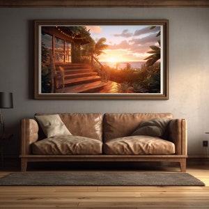 Puede incluir: Un sofá de cuero marrón con dos almohadas se encuentra frente a una imagen enmarcada de una escalera de madera que conduce a una playa con una puesta de sol en el fondo.