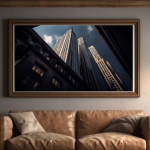 Puede incluir: Una fotografía enmarcada de un horizonte urbano con edificios altos. Los edificios están hechos de vidrio y acero y tienen un diseño moderno. La foto está tomada desde un ángulo bajo, mirando hacia arriba a los edificios.