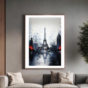 Puede incluir: Una pintura de acuarela de la Torre Eiffel en París, Francia. La torre está representada en blanco y negro, con salpicaduras de pintura de acuarela roja y azul a su alrededor. La torre se refleja en el agua de abajo.