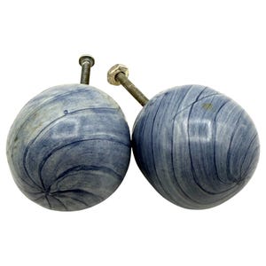 May include: A trio of ceramic mugs with a speckled, matte finish in light blue, cream, and grey. The mugs have a simple, modern design and a comfortable handle.