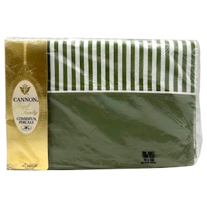 May include: A packaged twin flat sheet with green and white vertical stripes. The sheet is labeled "CANNON Royal Family COMBSPUN, PERCALE" and is made of all cotton. The package is 183 x 274 cm.