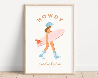 May include: A framed print with a white background and a cartoon illustration of a woman wearing a blue cowboy hat and boots, holding a pink surfboard. The text "HOWDY and aloha" is written in orange below the illustration.