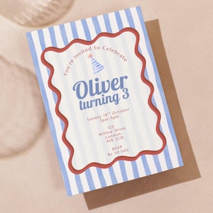 May include: A birthday invitation with blue and white striped background. The invitation has a red wavy border and text that reads "You're Invited to Celebrate", "Oliver turning 3", and event details.
