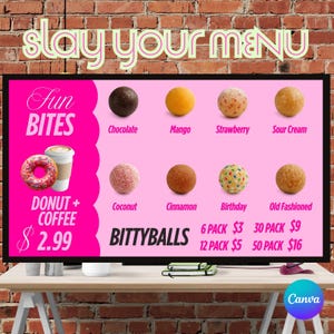 Könnte beinhalten: Eine rosa Menütafel mit dem Text "slay your menu" oben. Das Menü bietet "Fun Bites" mit Donut und Kaffee sowie "Bittyballs" in Geschmacksrichtungen wie Schokolade, Mango und Erdbeere. Der Preis für Donut und Kaffee beträgt 2,99 €.
