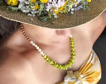 Hawaiian inspired jewelry designs that feature the sweet scented sandalwood and island flowers commonly used in lei
