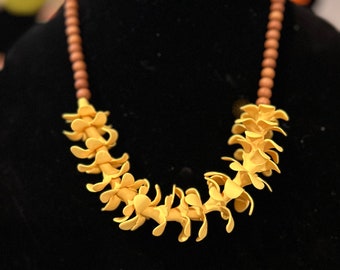 Iliahi and yellow puakenikeni necklace