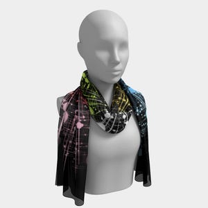 May include: A patterned infinity scarf featuring a black backdrop with a colourful abstract design. The pattern incorporates streaks of pink, yellow, green, and blue, creating a dynamic accessory. The scarf is displayed on a mannequin.