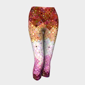 May include: Colourful patterned leggings with a geometric design featuring circles and squares in shades of red, orange, yellow, green, blue, and pink.