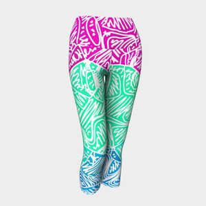 May include: A pair of cropped leggings featuring a colourful abstract pattern in shades of pink, blue, and green. The pattern is made up of white lines and shapes.