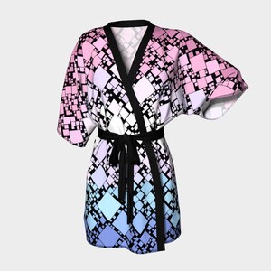 May include: A pink, blue, and white geometric patterned robe with a black sash. The robe has a kimono style with long sleeves and a wrap closure.