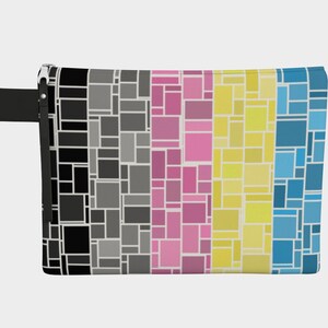 May include: A rectangular zipped pouch with a vibrant geometric design. The pattern features vertical sections of black, grey, pink, yellow, and blue squares and rectangles. A black strap is attached to the side.