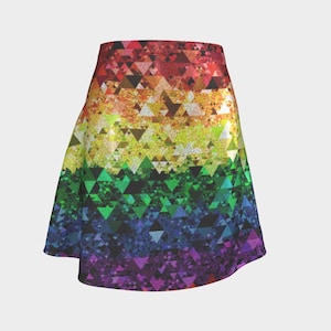 May include: A-line skirt with a vibrant geometric pattern in a rainbow of colors. The design features a repeating triangular motif, transitioning from red at the top to purple at the bottom. The skirt has a flared silhouette.