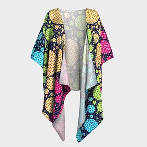 May include: A colorful kimono with a geometric pattern of circles in shades of blue, green, yellow, pink, and red on a dark blue background.