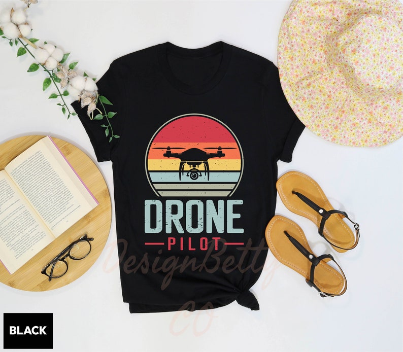 a t - shirt with a picture of a flying device on it