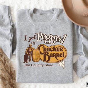 a t - shirt that says i got pegged on it