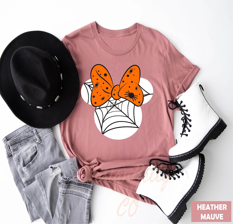 a t - shirt with a bow tie and a hat on top of it