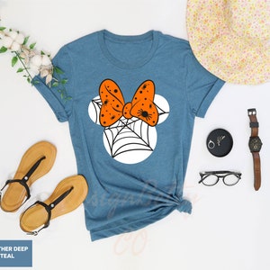 a t - shirt that has a bow on it