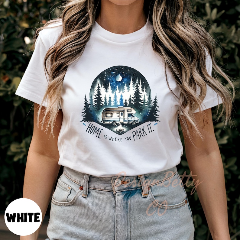 May include: White t-shirt with a graphic of a camper van parked in a forest at night. The text "Home is where you park it." is printed below the graphic.