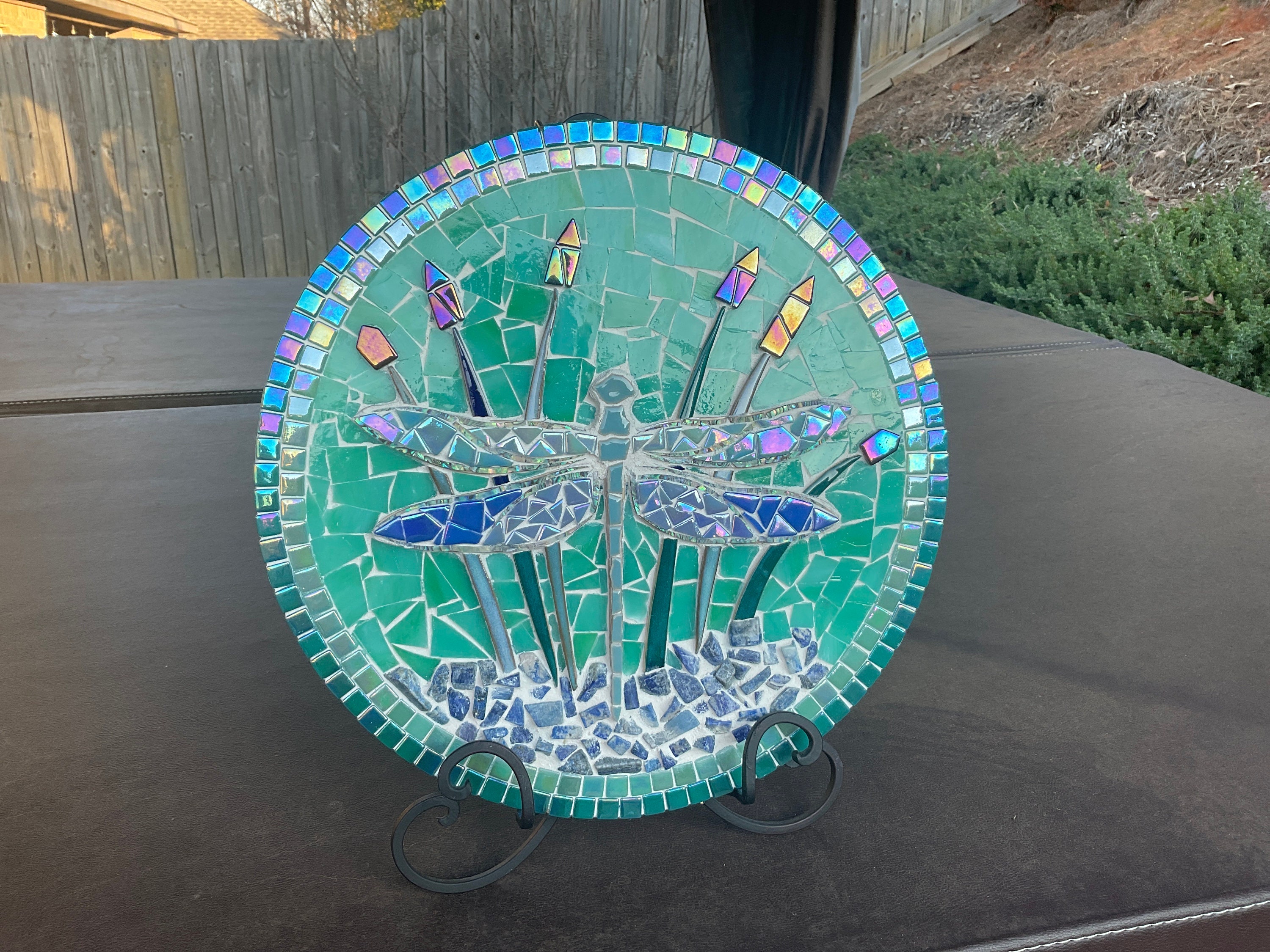 Dragonfly in the cattails, broken china and stained glass