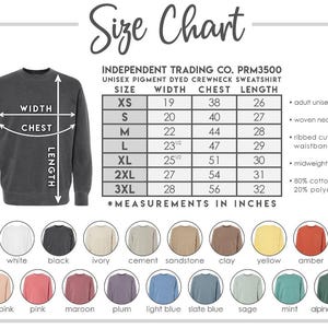 May include: Size chart for a unisex pigment dyed crewneck sweatshirt. The chart shows sizes XS through 3XL with measurements in inches for width, chest, and length. The sweatshirt is available in 14 colors: white, black, ivory, cement, sandstone, clay, yellow, amber, dusty pink, pink, maroon, plum, light blue, slate blue, sage, mint, and alpine green.