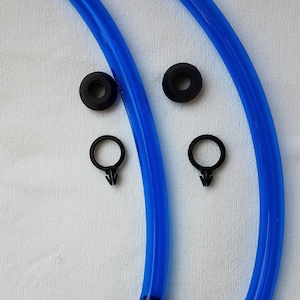 May include: Two blue flexible tubes with black connectors at the ends. Each tube has a black ring and a black clip attached to it.