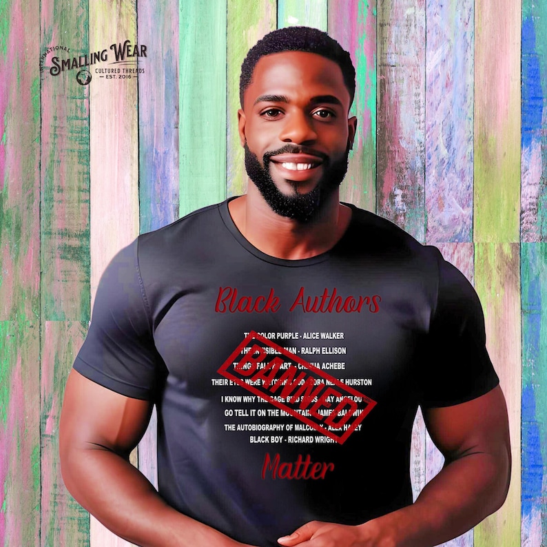 May include: A black t-shirt with the text "Black Authors" printed on the front. The text is crossed out with a red stamp that says "Banned".