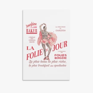 May include: A vintage poster advertising Josephine Baker performing at the Folies Bergère in Paris. The poster features a black and white image of Josephine Baker in a pink feather boa and a red and white costume. The text on the poster reads "Josephine Baker, L'Idole des Foules Dans La Folie du Jour, La Creatrice du Charleston, Folies Bergère, Le plus beau le plus riche, le plus troublant des spectacles."