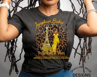 May include: Black and yellow graphic t-shirt featuring a woman walking a leopard in front of the Eiffel Tower. The text "Josephine Baker" and "Poire Noire de Paris" is printed on the shirt.