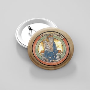 May include: A round button with a medieval illustration of a crowned figure holding a staff. The illustration is surrounded by a brown border with the text "Fanny hirnefide." The button is tan with a silver pin back.
