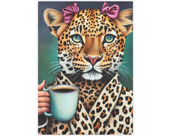 May include: A leopard wearing a leopard print dressing gown and pink bows in its hair, holding a cup of coffee.