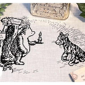 May include: Black and white cross-stitch embroidery of Winnie the Pooh and Tigger. Pooh is holding a plate with a candle on it. Tigger is sitting on the right side of the image. The text "RNIG ALSO" and "MR SANDERS" are on signs in the background.