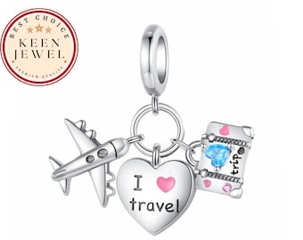 May include: A silver charm with travel-themed pendants. The charm includes a plane, a suitcase with a blue gem, and a heart with the words "I travel". The charm is attached to a silver ring.
