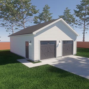 Può includere: Un garage bianco per due auto con tetto nero e due porte grigie. Il garage ha una piccola porta sul lato sinistro ed è circondato da erba verde, alberi e una recinzione marrone. Il cielo è blu.