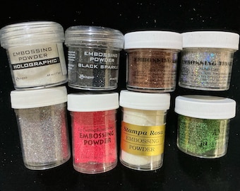 8 sparkly embossing powders from Ranger, Hampton Art and Stampa Rosa. Preowned. see description for colors.May have been slightly used.