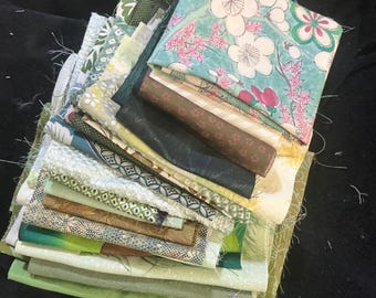 24 pieces of vintage kimono all silk. Various sizes. Large is 15 x 7. All in shades of green.   Smallest is 7 x 6. Great for slow stitching.