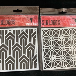 May include: Two white plastic stencils with geometric designs. The stencils are packaged in clear plastic bags with red and white labels that say "SINLOGOS STENCIL by Homeka".