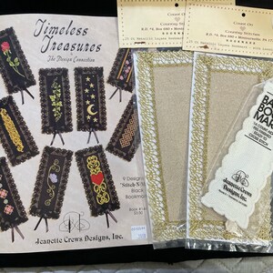 May include: A collection of cross-stitch supplies, including a pattern book titled "Timeless Treasures" with various bookmark designs, and several pre-finished bookmarks with gold trim. Also included is a basic bookmark ready for cross-stitch.