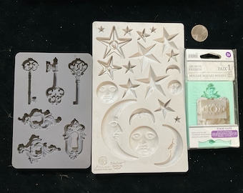 3 moulds, 1 by Finnabair suns, moons, stars, 1 keys and keyhole plates and 1 by Iron Orchid Decor