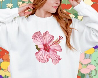 May include: White sweatshirt with a pink hibiscus flower graphic print.