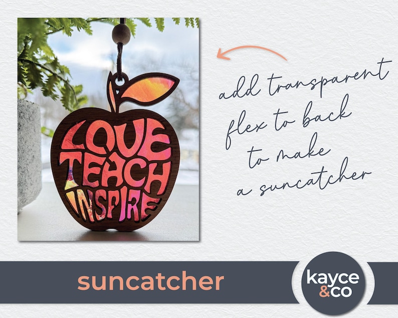 May include: A red apple-shaped wooden suncatcher with the words "Love Teach Inspire" cut out. The apple has a pink and orange stained glass effect.